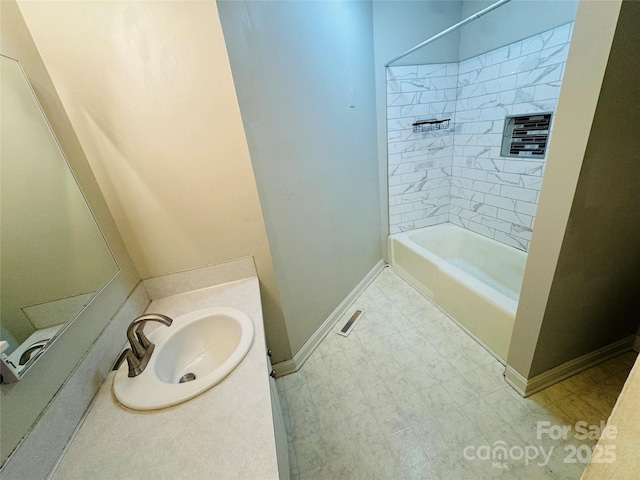 316 Meadowood Cir, Kannapolis, NC 28081 - bathroom featuring baseboards, vanity, and tub / shower combination