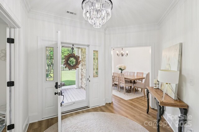 2018 Whiskery Ct, York, SC 29745 - foyer entrance featuring a chandelier, wood finished floors, and crown molding
