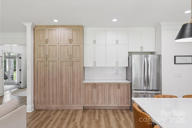 2018 Whiskery Ct, York, SC 29745 - kitchen with freestanding refrigerator, light countertops, light wood finished floors, tasteful backsplash, and recessed lighting
