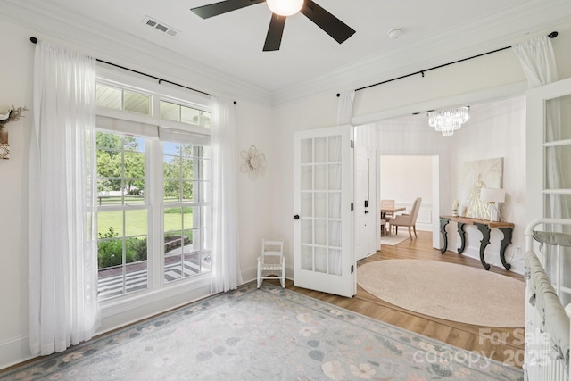 2018 Whiskery Ct, York, SC 29745 - entryway featuring ornamental molding, french doors, wood finished floors, a chandelier, and ceiling fan