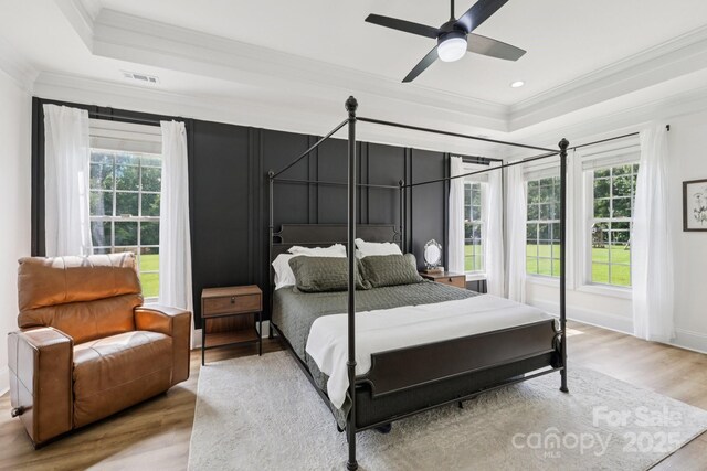 2018 Whiskery Ct, York, SC 29745 - bedroom with a raised ceiling, ornamental molding, wood finished floors, multiple windows, and ceiling fan
