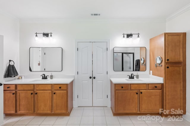 2018 Whiskery Ct, York, SC 29745 - bathroom featuring crown molding, two vanities, a closet, and tile patterned floors
