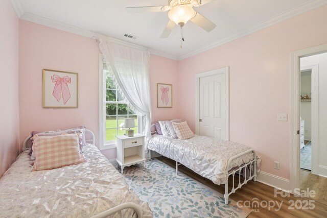2018 Whiskery Ct, York, SC 29745 - bedroom with wood finished floors, crown molding, and ceiling fan