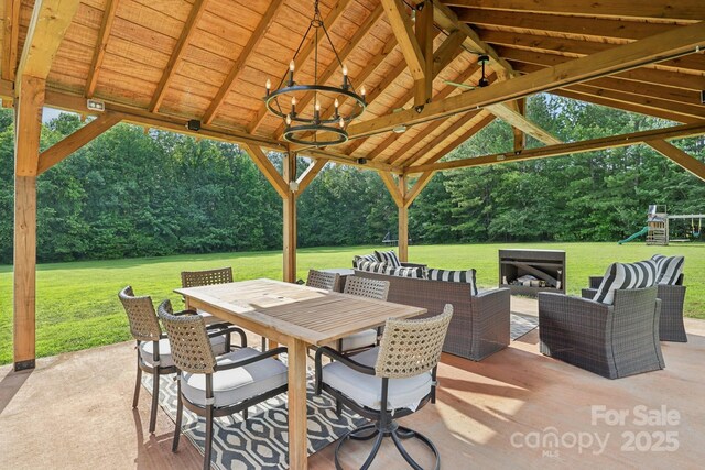 2018 Whiskery Ct, York, SC 29745 - view of patio / terrace with a playground, an outdoor hangout area, a gazebo, outdoor dining space, and view of scattered trees
