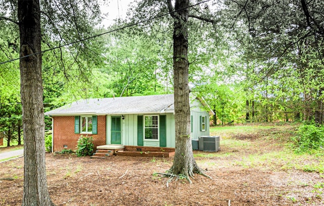 24 19th St NW, Hickory, NC 28601 - ranch-style home with central AC, brick siding, and a shingled roof