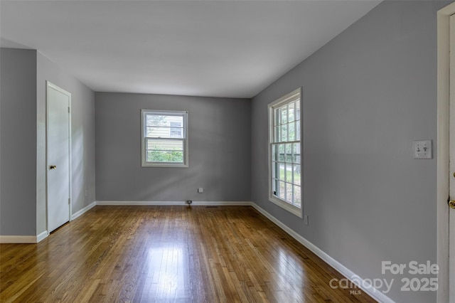 24 19th St NW, Hickory, NC 28601 - empty room featuring hardwood / wood-style flooring and baseboards