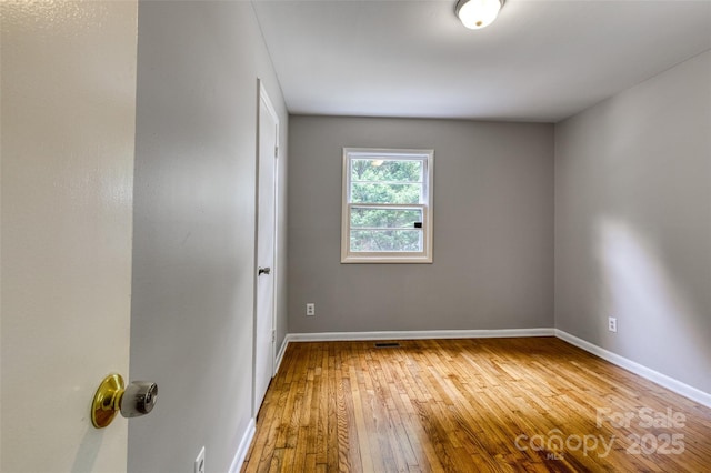 24 19th St NW, Hickory, NC 28601 - empty room featuring hardwood / wood-style floors and baseboards