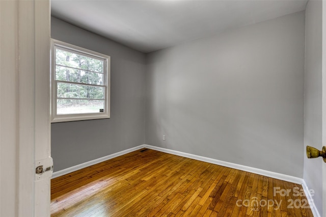 24 19th St NW, Hickory, NC 28601 - unfurnished room with hardwood / wood-style floors and baseboards