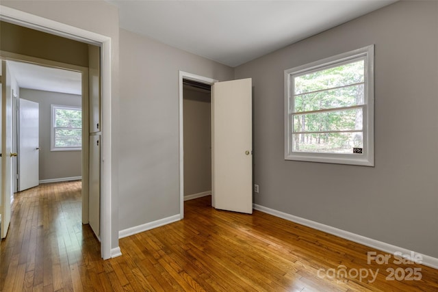 24 19th St NW, Hickory, NC 28601 - unfurnished bedroom featuring baseboards and hardwood / wood-style flooring