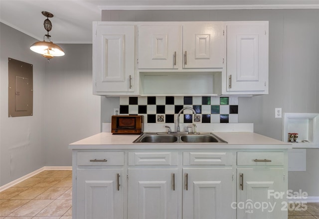 24 19th St NW, Hickory, NC 28601 - kitchen featuring electric panel, a sink, tasteful backsplash, light countertops, and white cabinets