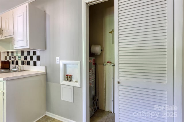 24 19th St NW, Hickory, NC 28601 - bathroom with tasteful backsplash, vanity, tile patterned flooring, and water heater