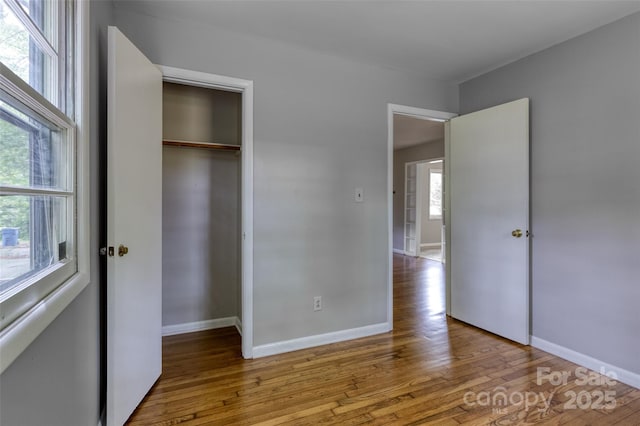 24 19th St NW, Hickory, NC 28601 - unfurnished bedroom with wood finished floors and a closet