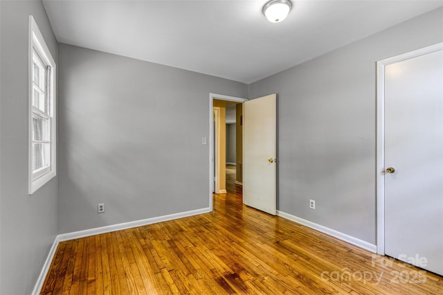 24 19th St NW, Hickory, NC 28601 - unfurnished bedroom featuring baseboards and hardwood / wood-style flooring