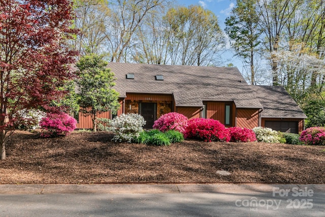 1601 Wandering Way Dr, Charlotte, NC 28226 - view of side of home featuring roof with shingles and a garage