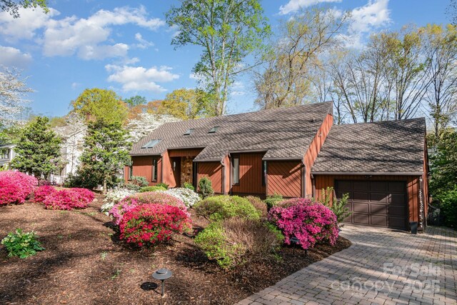 1601 Wandering Way Dr, Charlotte, NC 28226 - view of front facade with an attached garage, driveway, and a shingled roof
