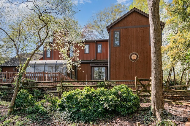 1601 Wandering Way Dr, Charlotte, NC 28226 - rear view of property featuring a deck and a sunroom