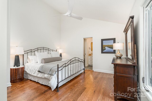 1601 Wandering Way Dr, Charlotte, NC 28226 - bedroom featuring wood finished floors, multiple windows, high vaulted ceiling, ensuite bathroom, and ceiling fan