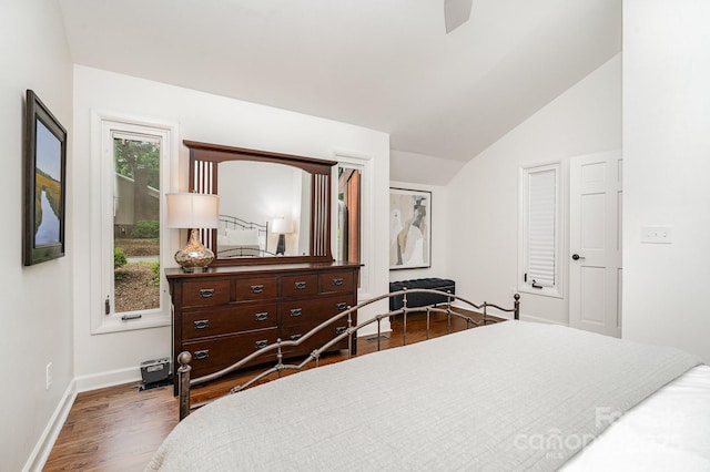 1601 Wandering Way Dr, Charlotte, NC 28226 - bedroom featuring lofted ceiling, dark wood-style flooring, and a ceiling fan