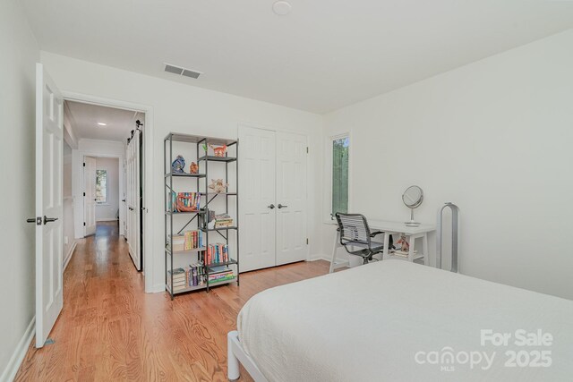 1601 Wandering Way Dr, Charlotte, NC 28226 - bedroom with light wood-type flooring and a closet