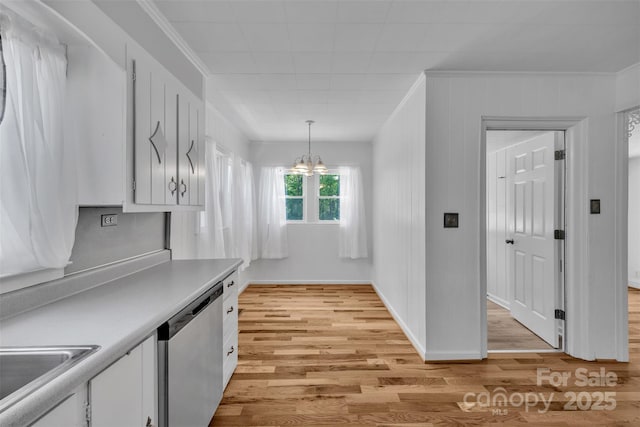 3804 Lippard Ln, Valdese, NC 28690 - kitchen featuring dishwasher, a chandelier, crown molding, light countertops, and light wood-type flooring