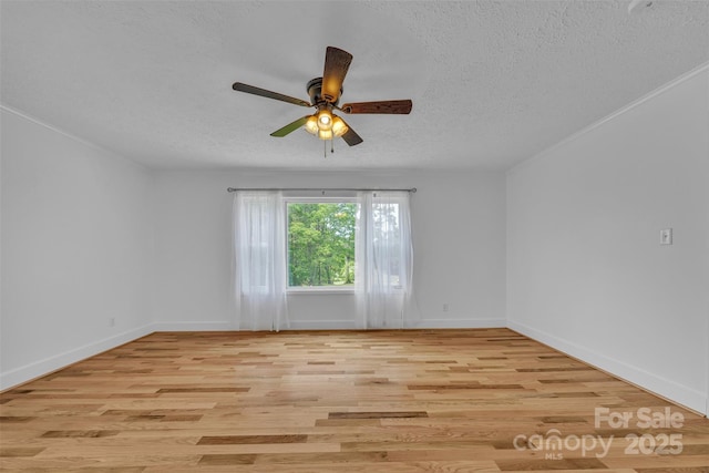 3804 Lippard Ln, Valdese, NC 28690 - empty room featuring a textured ceiling, ceiling fan, light wood-type flooring, and baseboards