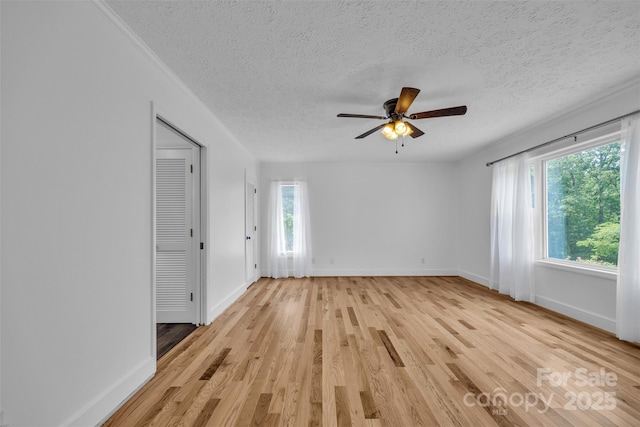 3804 Lippard Ln, Valdese, NC 28690 - unfurnished room with light wood-style floors, a ceiling fan, baseboards, and a textured ceiling