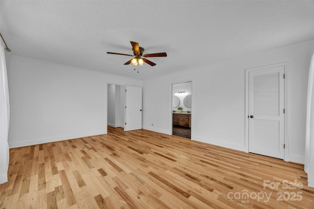 3804 Lippard Ln, Valdese, NC 28690 - unfurnished bedroom featuring light wood-type flooring, crown molding, baseboards, connected bathroom, and ceiling fan