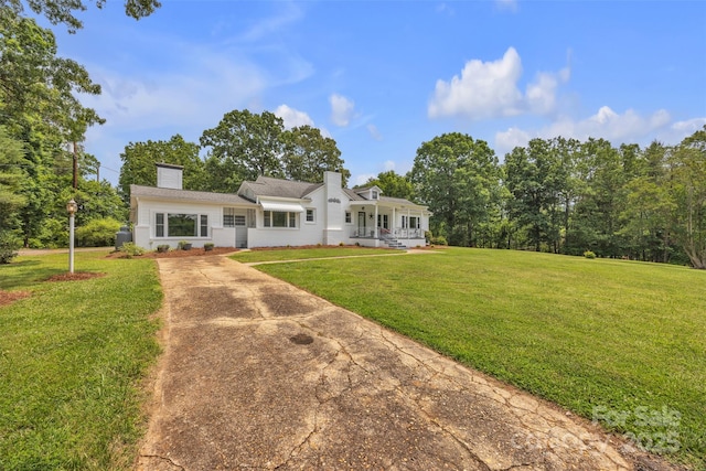 3804 Lippard Ln, Valdese, NC 28690 - view of front of house with driveway, a chimney, a front yard, and a porch