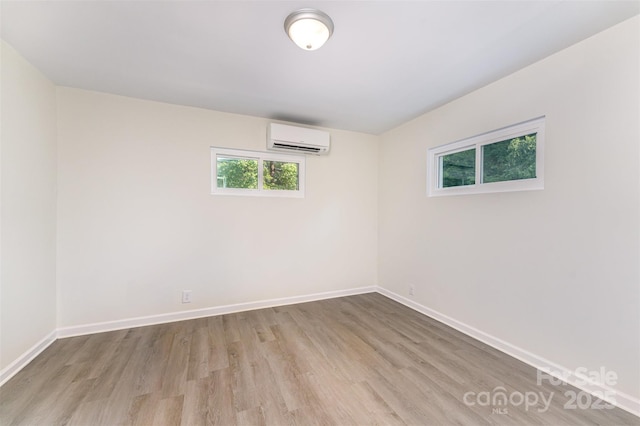112 Lineberger St, Stanley, NC 28164 - empty room featuring a wall mounted air conditioner and wood finished floors