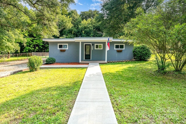 112 Lineberger St, Stanley, NC 28164 - view of front of house featuring concrete block siding and a porch