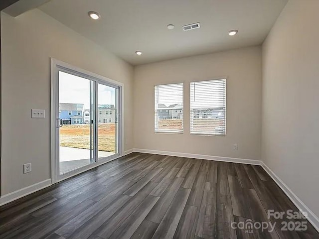 213 Jp Dr, Albemarle, NC 28001 - unfurnished room with dark wood-style flooring, baseboards, and recessed lighting