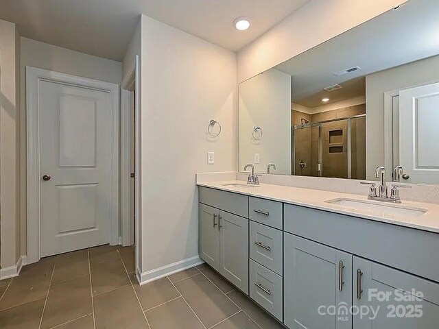 213 Jp Dr, Albemarle, NC 28001 - full bathroom featuring baseboards, double vanity, tile patterned floors, a stall shower, and recessed lighting