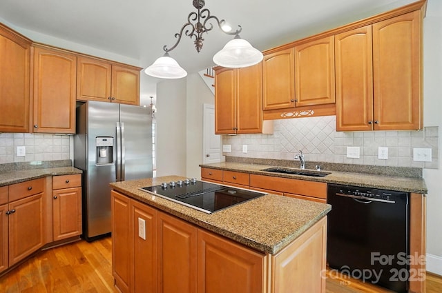 3735 Gordon St, Terrell, NC 28682 - kitchen with black appliances, a sink, light wood-type flooring, and a center island