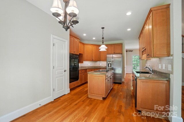 3735 Gordon St, Terrell, NC 28682 - kitchen with stainless steel fridge with ice dispenser, a sink, multiple ovens, a kitchen island, and decorative backsplash