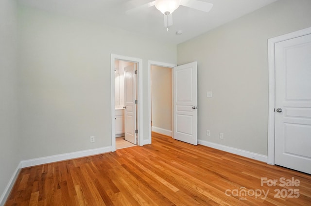 3735 Gordon St, Terrell, NC 28682 - unfurnished bedroom featuring light wood-style flooring, baseboards, ensuite bath, and a ceiling fan