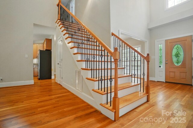 3735 Gordon St, Terrell, NC 28682 - entrance foyer featuring a high ceiling, light wood-style floors, stairway, and baseboards