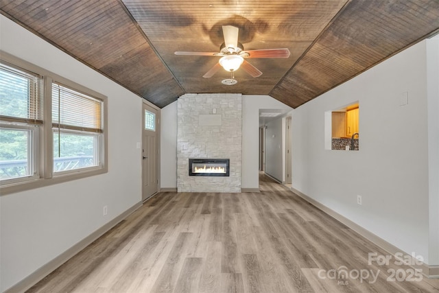 1598 Claybank Rd, West Jefferson, NC 28694 - unfurnished living room with light wood-style flooring, wooden ceiling, vaulted ceiling, a fireplace, and ceiling fan