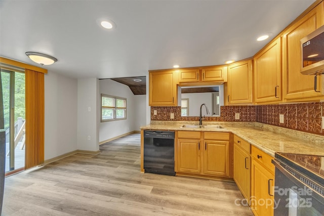 1598 Claybank Rd, West Jefferson, NC 28694 - kitchen with black dishwasher, a sink, decorative backsplash, light wood-style flooring, and baseboards