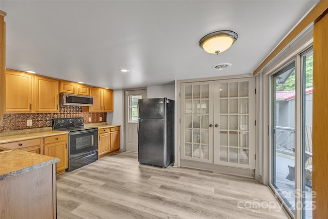 1598 Claybank Rd, West Jefferson, NC 28694 - kitchen with black appliances, light countertops, light wood-style flooring, decorative backsplash, and recessed lighting