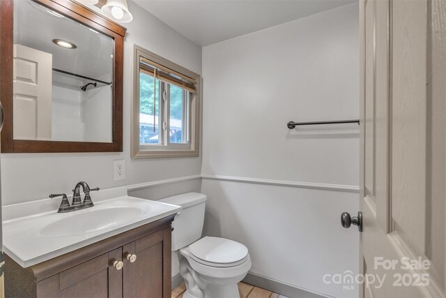 1598 Claybank Rd, West Jefferson, NC 28694 - full bath featuring vanity, toilet, tile patterned flooring, and a shower