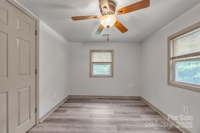1598 Claybank Rd, West Jefferson, NC 28694 - spare room featuring light wood-type flooring, ceiling fan, and baseboards