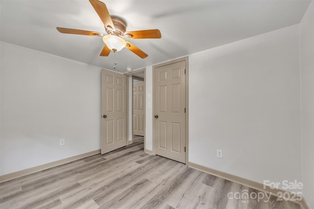 1598 Claybank Rd, West Jefferson, NC 28694 - unfurnished bedroom featuring wood finished floors, baseboards, and ceiling fan