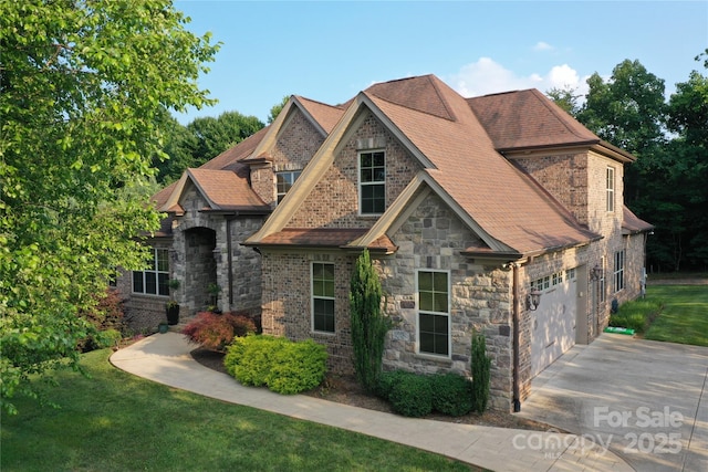 6302 Dwayne Starnes Dr, Hickory, NC 28602 - view of front of home featuring concrete driveway, stone siding, roof with shingles, and a front lawn