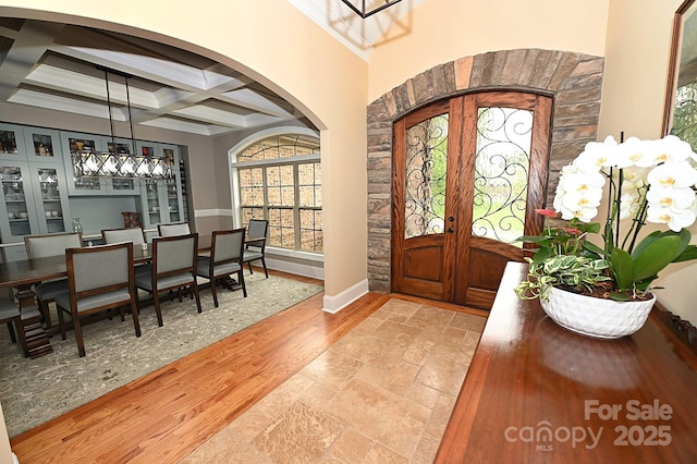 6302 Dwayne Starnes Dr, Hickory, NC 28602 - foyer entrance with arched walkways, french doors, coffered ceiling, plenty of natural light, and beamed ceiling