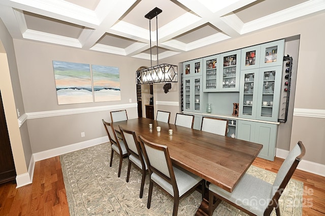 6302 Dwayne Starnes Dr, Hickory, NC 28602 - dining space with coffered ceiling, a chandelier, light wood finished floors, beam ceiling, and baseboards