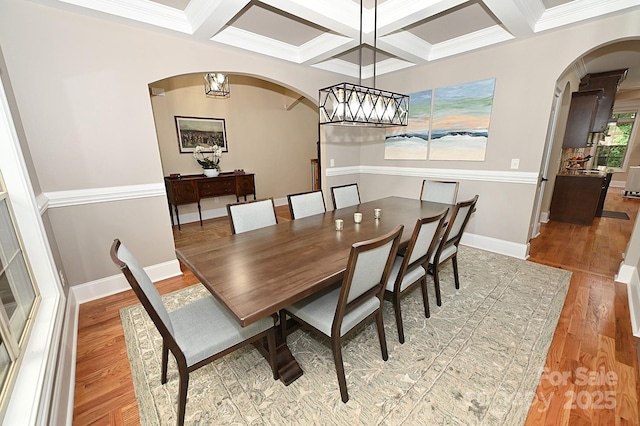 6302 Dwayne Starnes Dr, Hickory, NC 28602 - dining area with arched walkways, coffered ceiling, wood finished floors, ornamental molding, and beamed ceiling