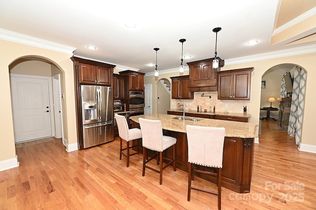 6302 Dwayne Starnes Dr, Hickory, NC 28602 - kitchen with appliances with stainless steel finishes, arched walkways, backsplash, a sink, and crown molding
