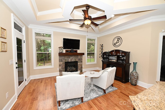 6302 Dwayne Starnes Dr, Hickory, NC 28602 - living room featuring ceiling fan, light wood-type flooring, crown molding, a stone fireplace, and coffered ceiling