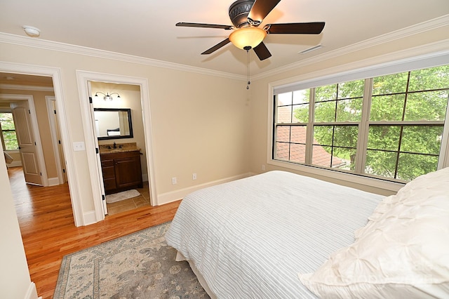6302 Dwayne Starnes Dr, Hickory, NC 28602 - bedroom featuring light wood-style floors, ornamental molding, baseboards, a sink, and connected bathroom