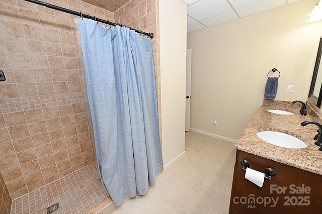 6302 Dwayne Starnes Dr, Hickory, NC 28602 - bathroom with tile patterned flooring, a shower stall, double vanity, a paneled ceiling, and baseboards